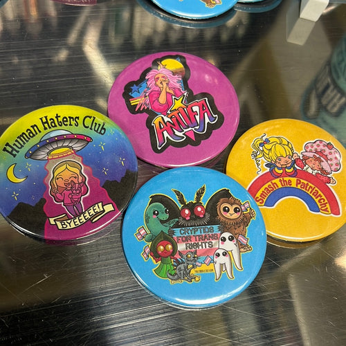 Assorted 2.25” buttons (multiple designs)